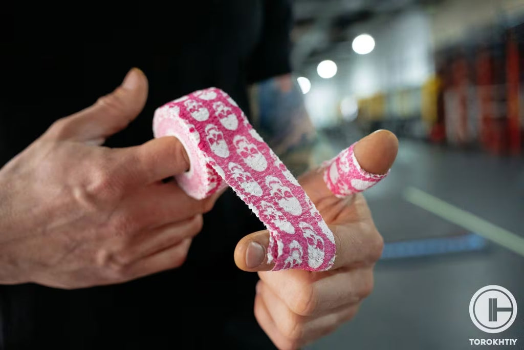 Barbell UP Weightlifting Thumb Tape in use