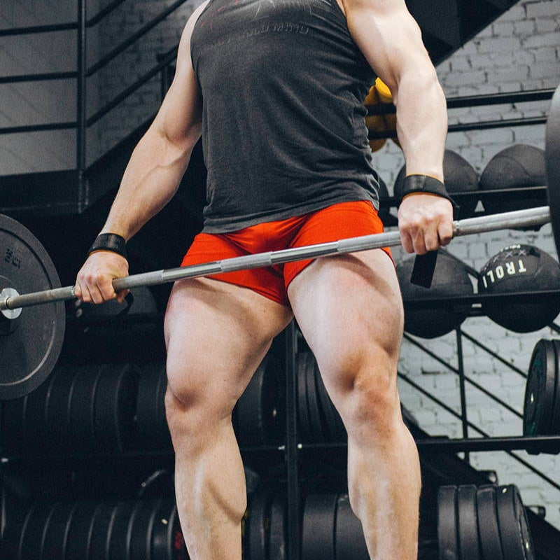 Person lifting a barbell in a gym setting (Torokhtiy Weightlifting)