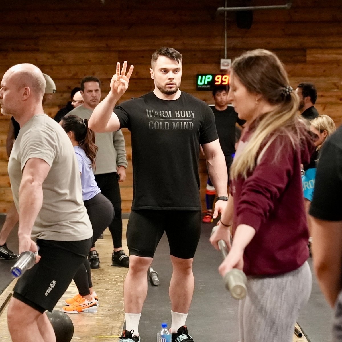 Oleksiy Torokhtiy at Olympic Lifting Weekends New York explaining to group of athletes